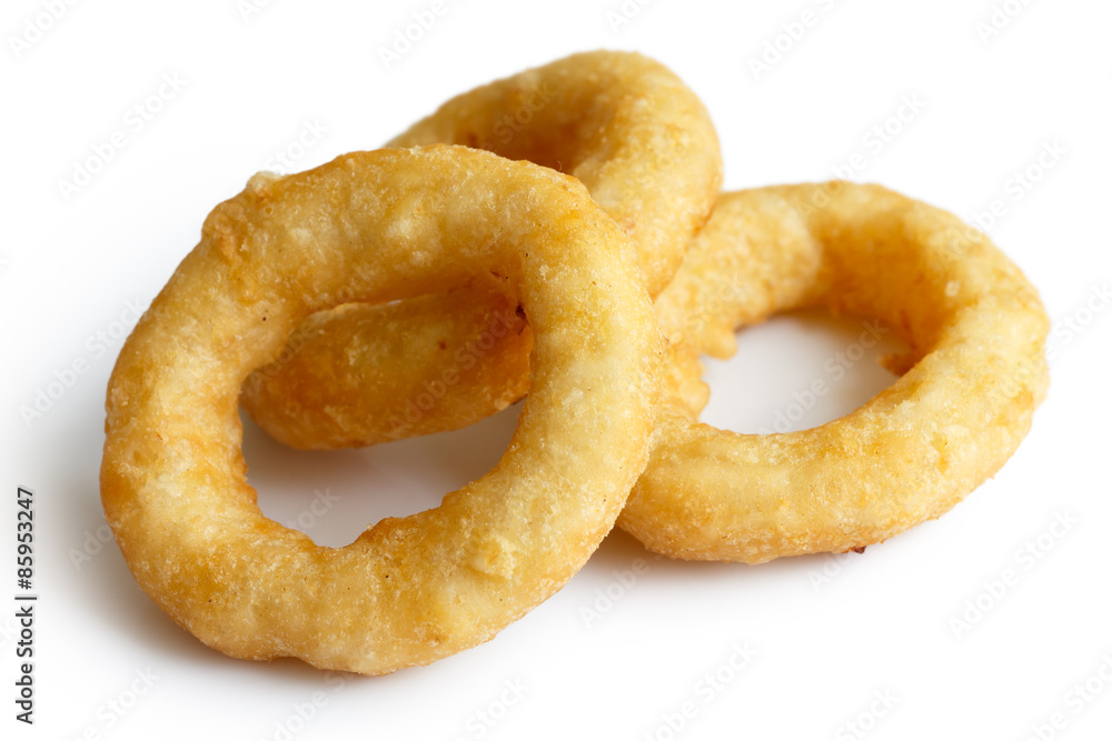 Three deep fried onion or calamari rings isolated on white. Three deep fried onion or calamari rings isolated on white.