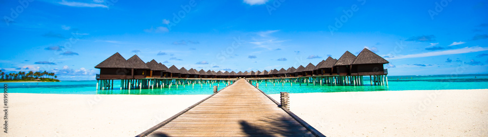 Water bungalows and wooden jetty on Maldives