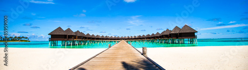 Obraz na plátně Water bungalows and wooden jetty on Maldives