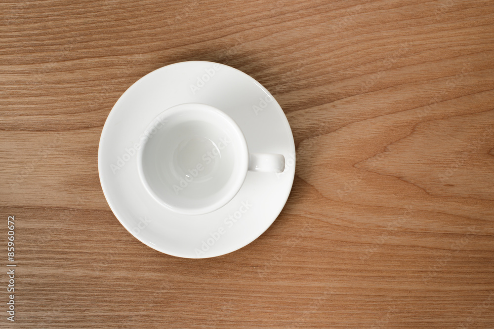 Obraz premium white espresso cup on a wooden plate