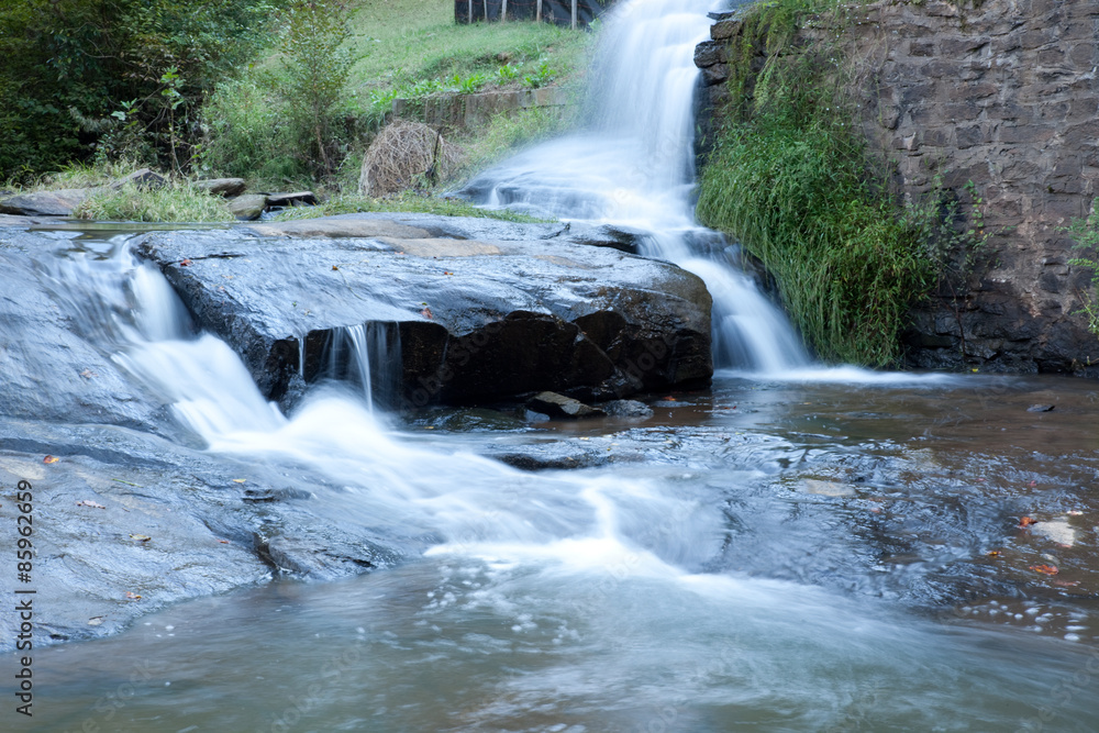 Fototapeta premium Waterfall on rocks below