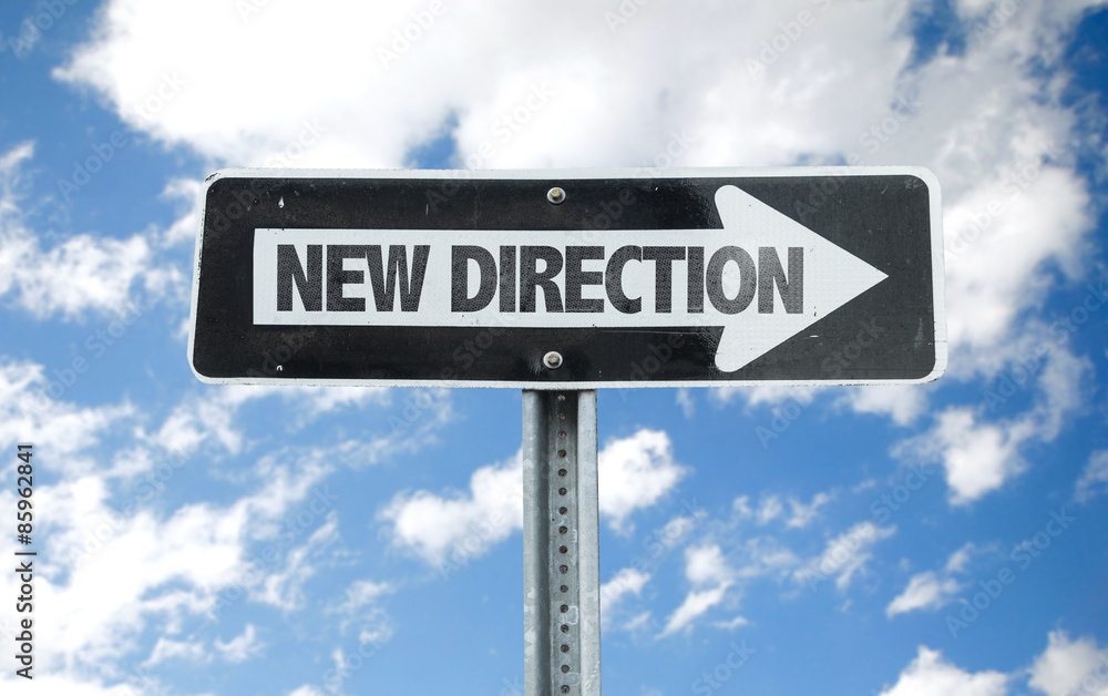 New Direction direction sign with sky background New Direction direction sign with sky background