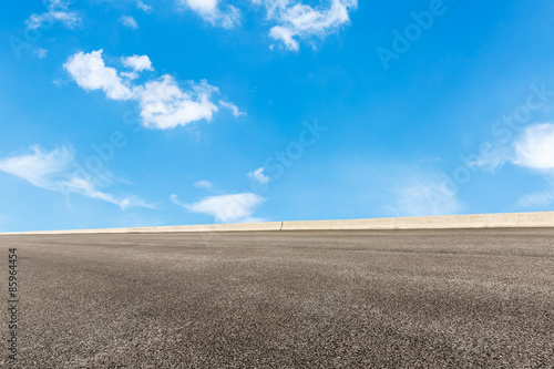 Empty of asphalt road in front of the blue sky