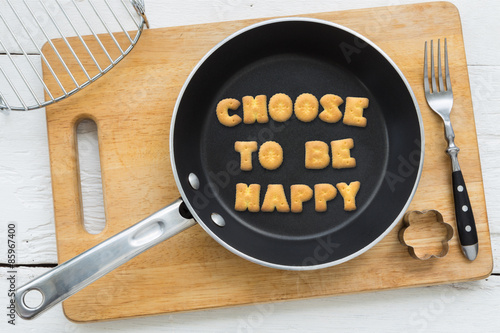 Fotografie Alphabet biscuits quote CHOOSE TO BE HAPPY kitchenware