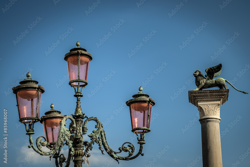 Lamppost in Venice with the Saint Mark's lion in the background