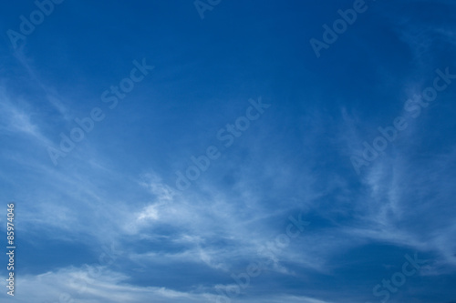 Sligtly clouds floating on the clear blue sky