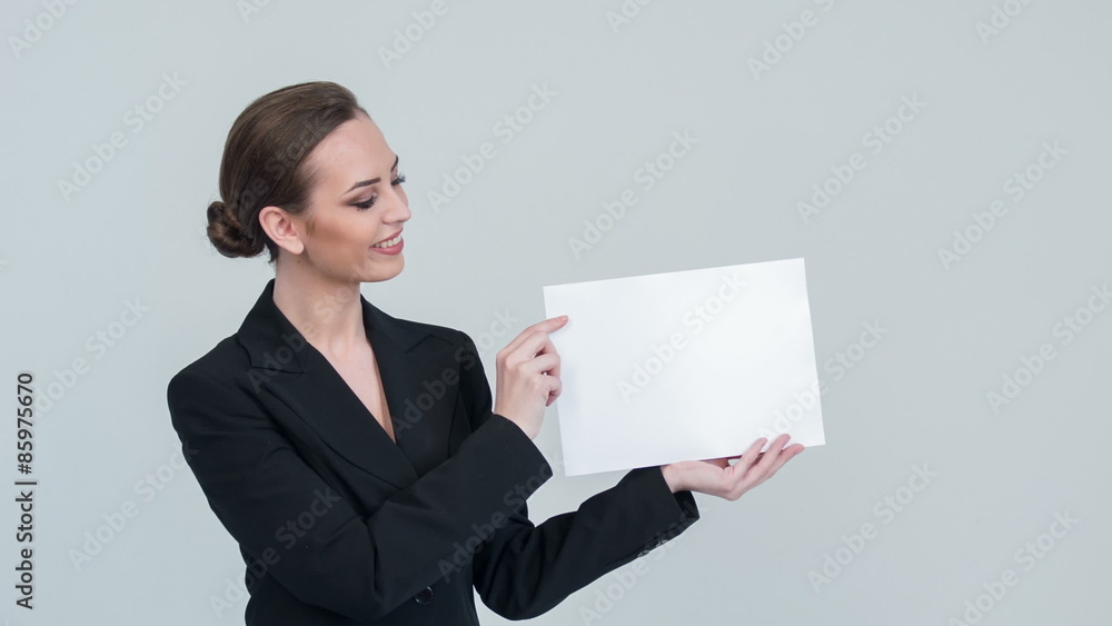 Lady pointing something on white paper Lady pointing something on white paper