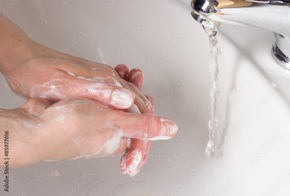 Fototapeta premium woman washing her hands