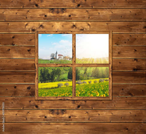 Wooden window with views of spring landscape