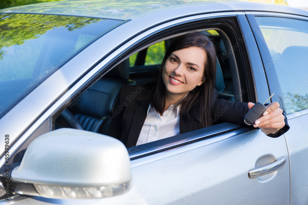 driver business woman showing new car keys and car