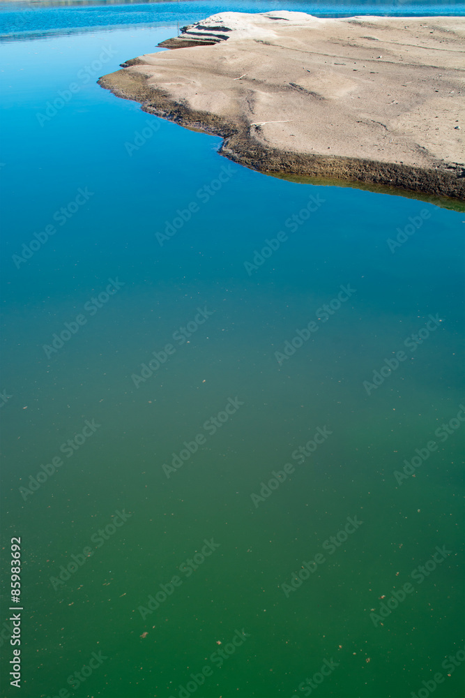 sandbank of river in water foreground