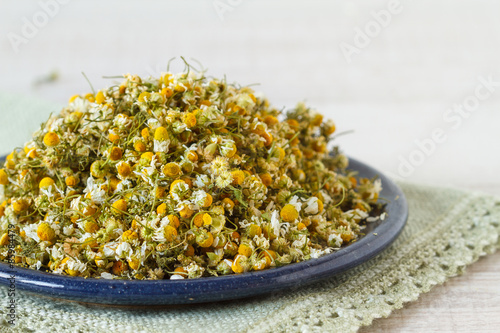 A pile of dried chamomile flowers 