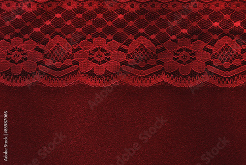 red lace on red velvet paper background
