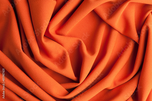 Spiral folds on red cloth