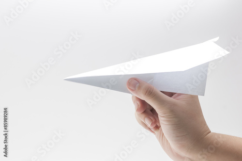 woman's hand take the paper plane
