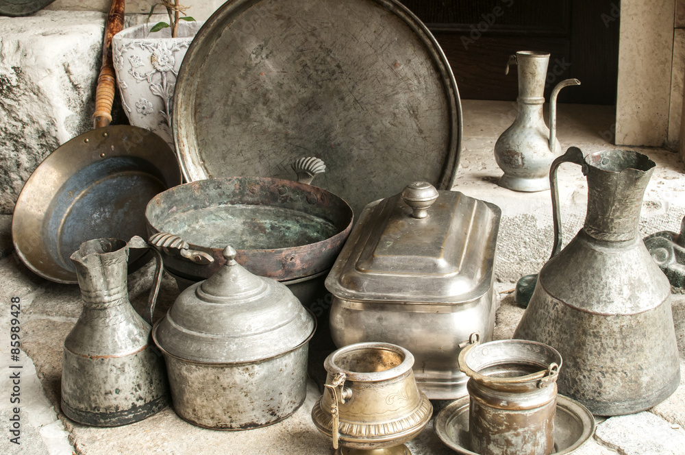 Old used retro antique metal vessels cutlery and crockery for flea market Stock Photo Adobe Stock