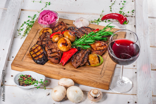 Grilled pieces of meat and different vegetables