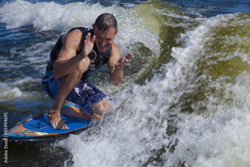 Fun man wake surfing 