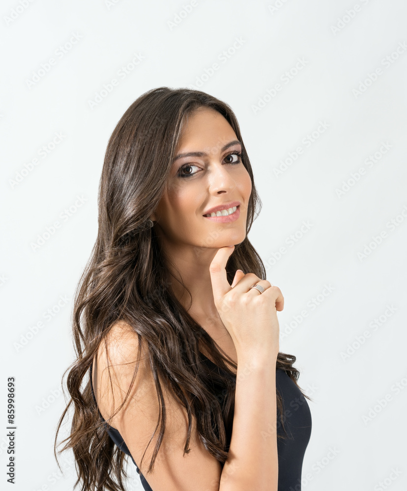 Portrait of sensual attractive brunette smiling at camera Portrait of sensual attractive brunette smiling at camera