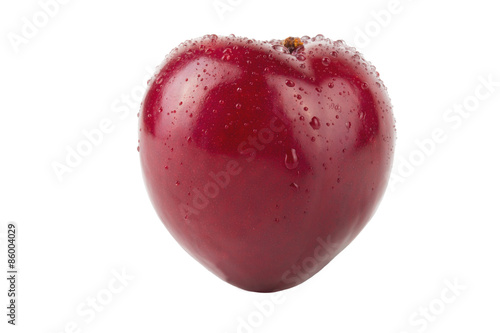 Fresh plum with drops of water isolated on white background