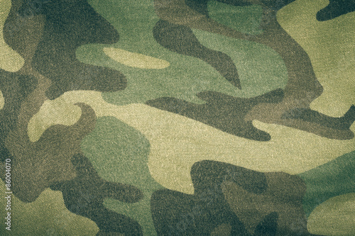 Fabrics with camouflage pattern. Background. Toned