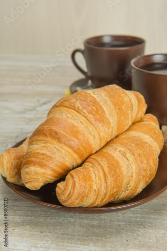 croissants and coffee in cups