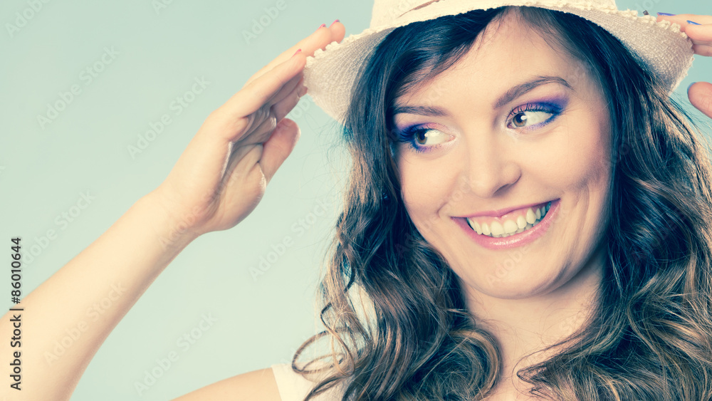 Obraz premium Charming woman in summer straw hat