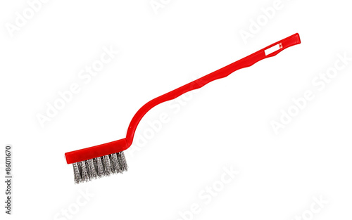 Close-up of metal brush on white background.