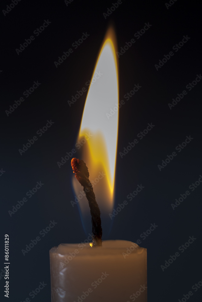 Candle flame close up in black background Candle flame close up in black background