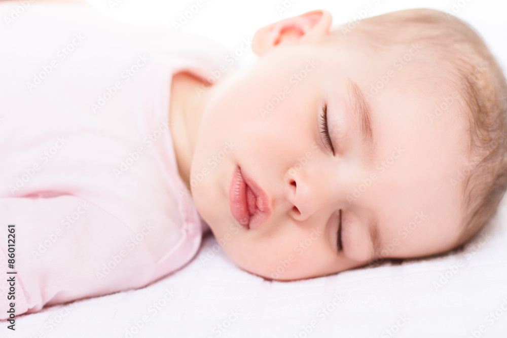 Close-up portrait of a beautiful sleeping baby on white Close-up portrait of a beautiful sleeping baby on white