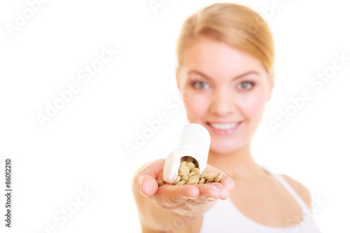 Woman girl holding vitamins pills. Health care.