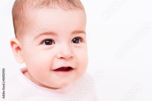 Close-up portrait of a beautiful baby on white background