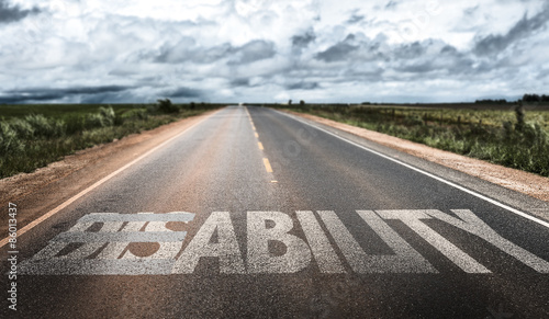 Disability/Ability written on rural road