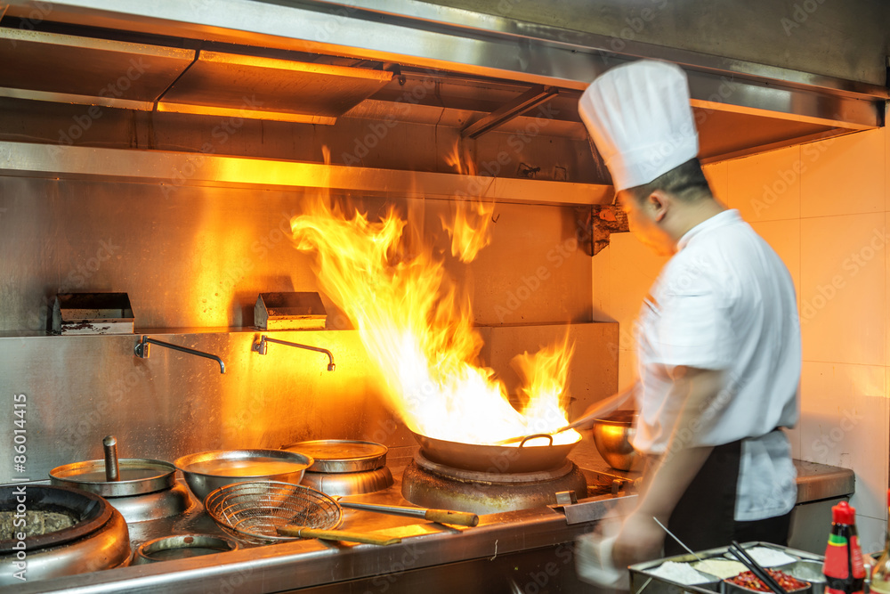 Crowded kitchen, a narrow aisle, working chef. Crowded kitchen, a narrow aisle, working chef.
