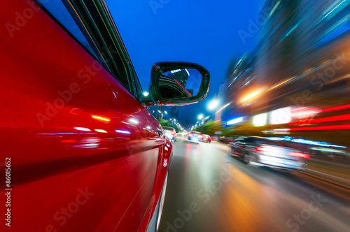 Bilde på lerret A car driving on a motorway at high speeds, overtaking other cars