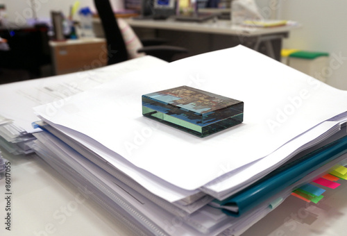 Paperweight on documents