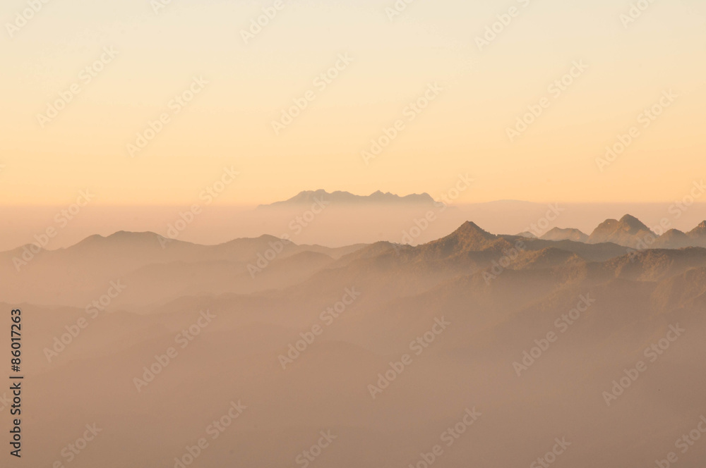 misty morning sunrise in mountain at  Doi Phahompok national par