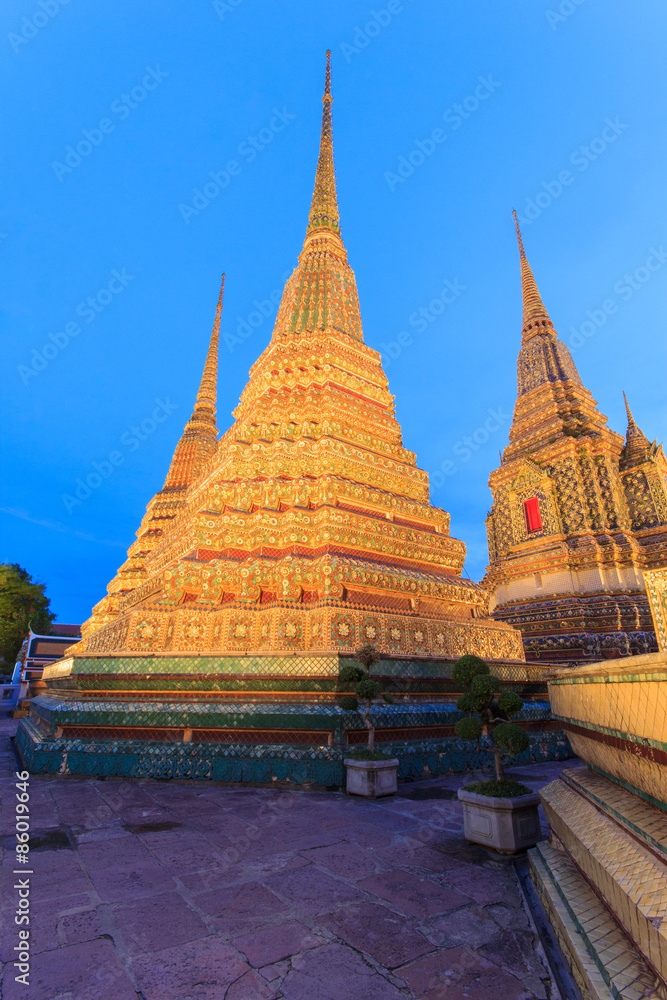 Fototapeta premium Wat Pho, Bangkok, Thailand. Also known as Wat Phra Chetuphon, 'Wat' means temple in Thai. The temple is one of Bangkok's most famous tourist sites. The temple has it's origins dating back to 1788.