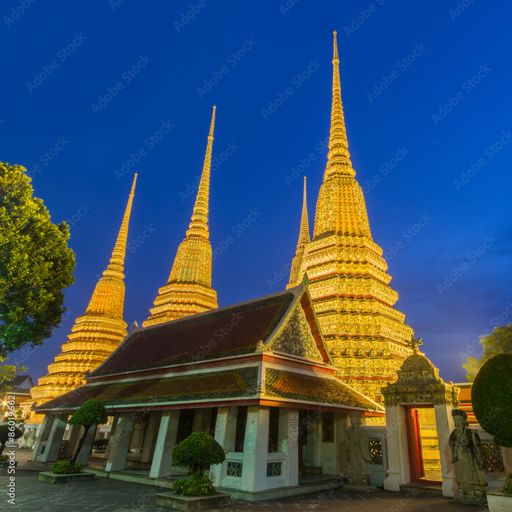 Naklejka premium Wat Pho, Bangkok, Thailand. Also known as Wat Phra Chetuphon, 'Wat' means temple in Thai. The temple is one of Bangkok's most famous tourist sites. The temple has it's origins dating back to 1788.