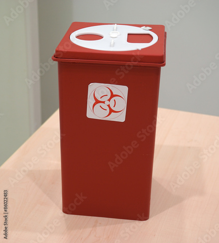 Sharps collector container on the table