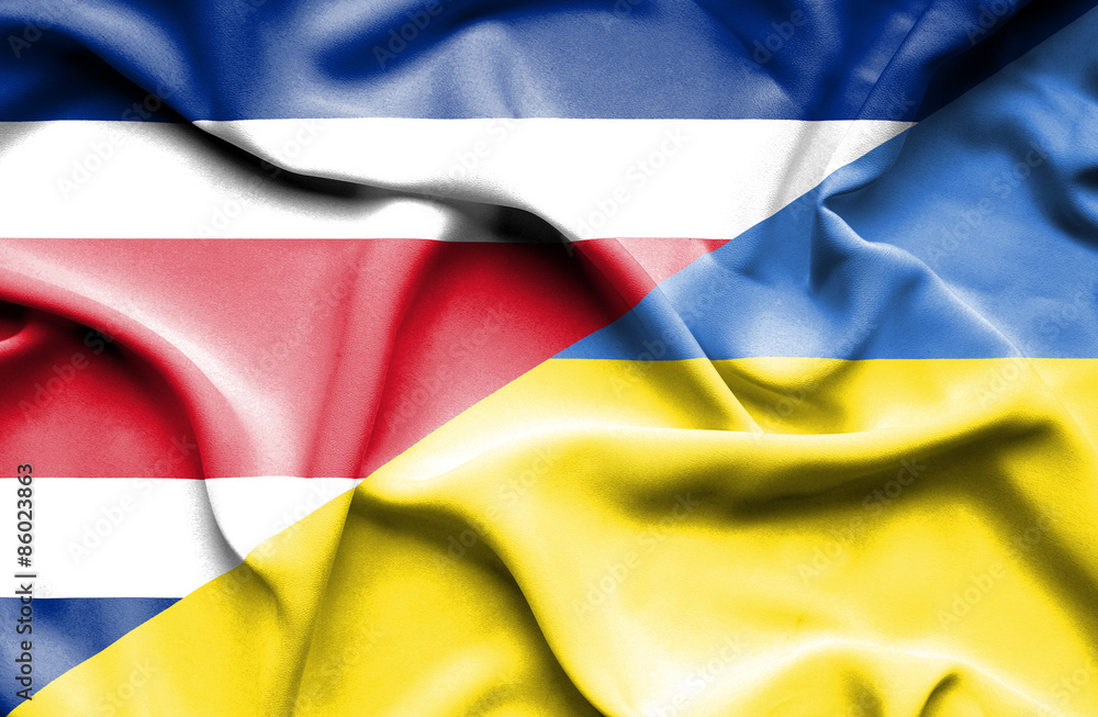 Waving flag of Ukraine and Costa Rica Waving flag of Ukraine and Costa Rica