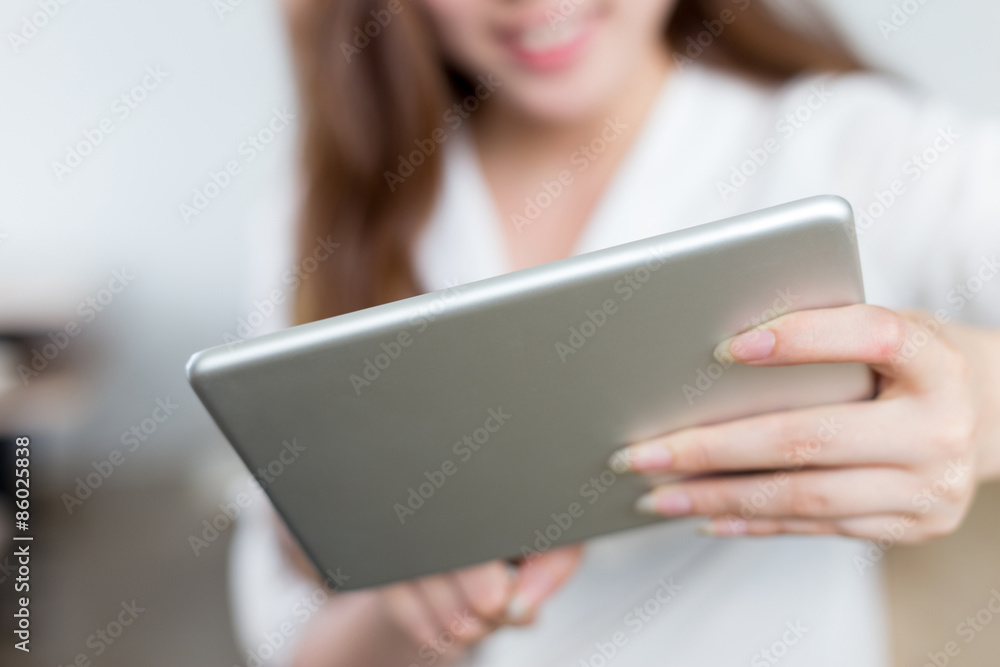 Asian beautiful female student study with tablet in classroom Asian beautiful female student study with tablet in classroom