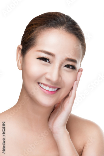 Pretty beautiful woman face with health skin and white lily in her hairs,isolated on white with clipping path