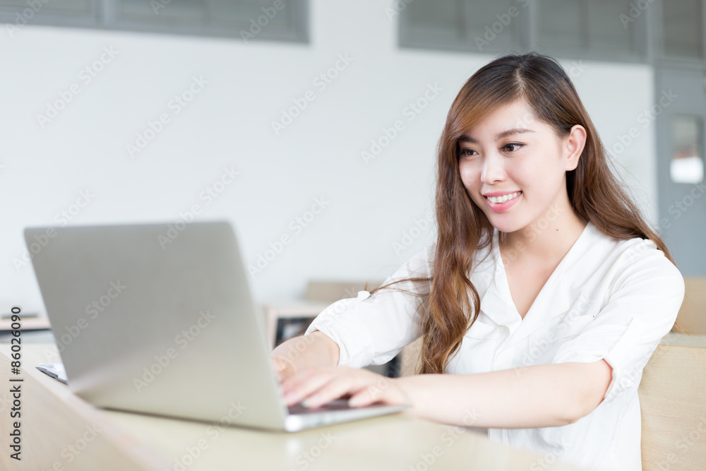 Asian beautiful female student study with laptop in classroom Asian beautiful female student study with laptop in classroom