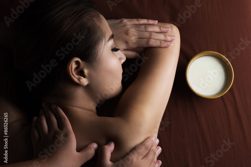 Asian woman having massage and spa salon Beauty treatment concept photo