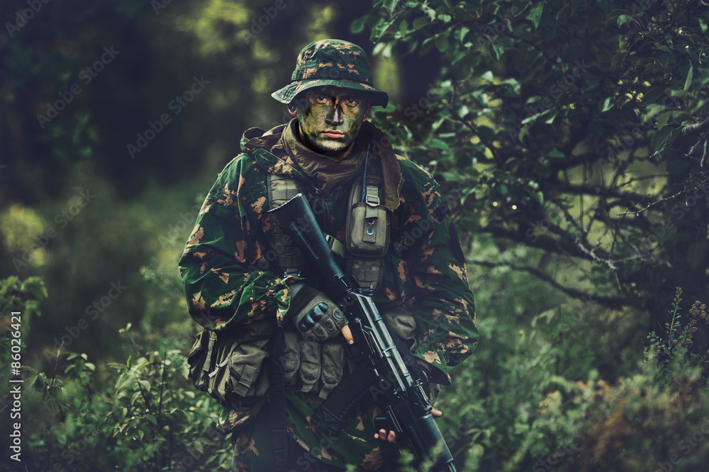 soldier in forest area at twilight