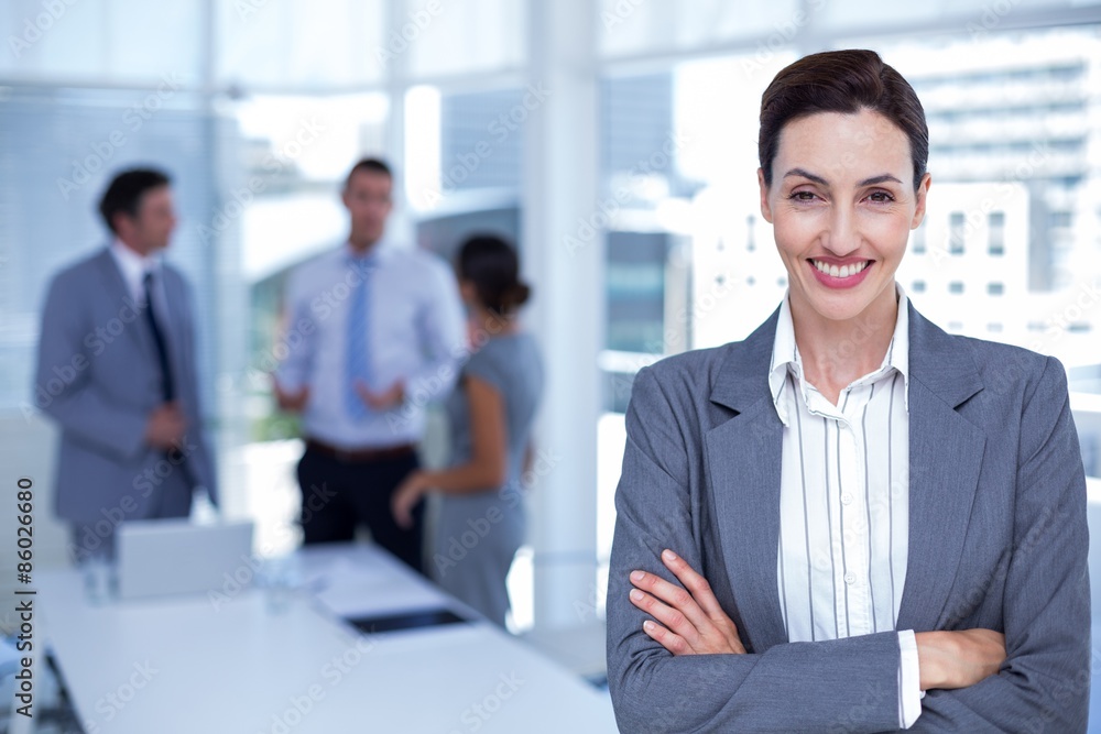 Smiling businesswoman with arms crossed Smiling businesswoman with arms crossed