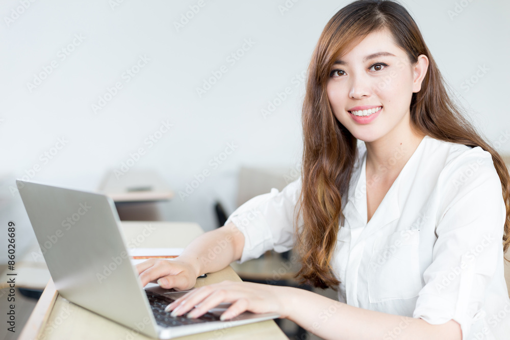 Asian beautiful female student study with laptop in classroom Asian beautiful female student study with laptop in classroom
