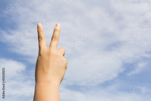 Hand making victory sign
