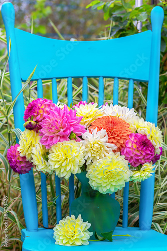 Fototapeta Naklejka Na Ścianę i Meble -  Blue Chair and Dahlias